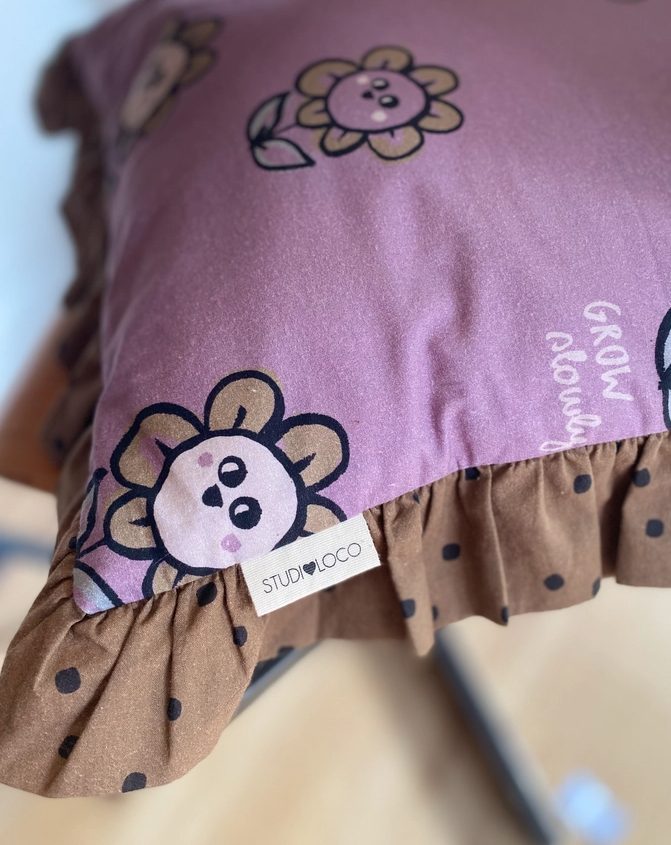 Floral and dotted print frilled cushion