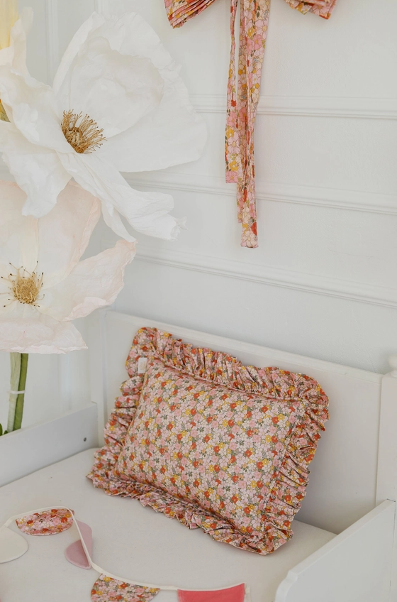 Floral print pillow with ruffles