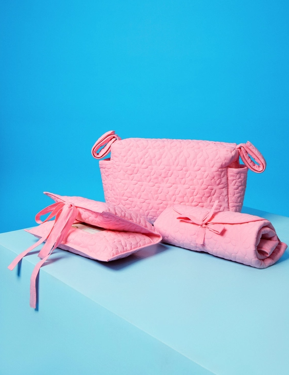 pink quilt diaper and wipe accessories